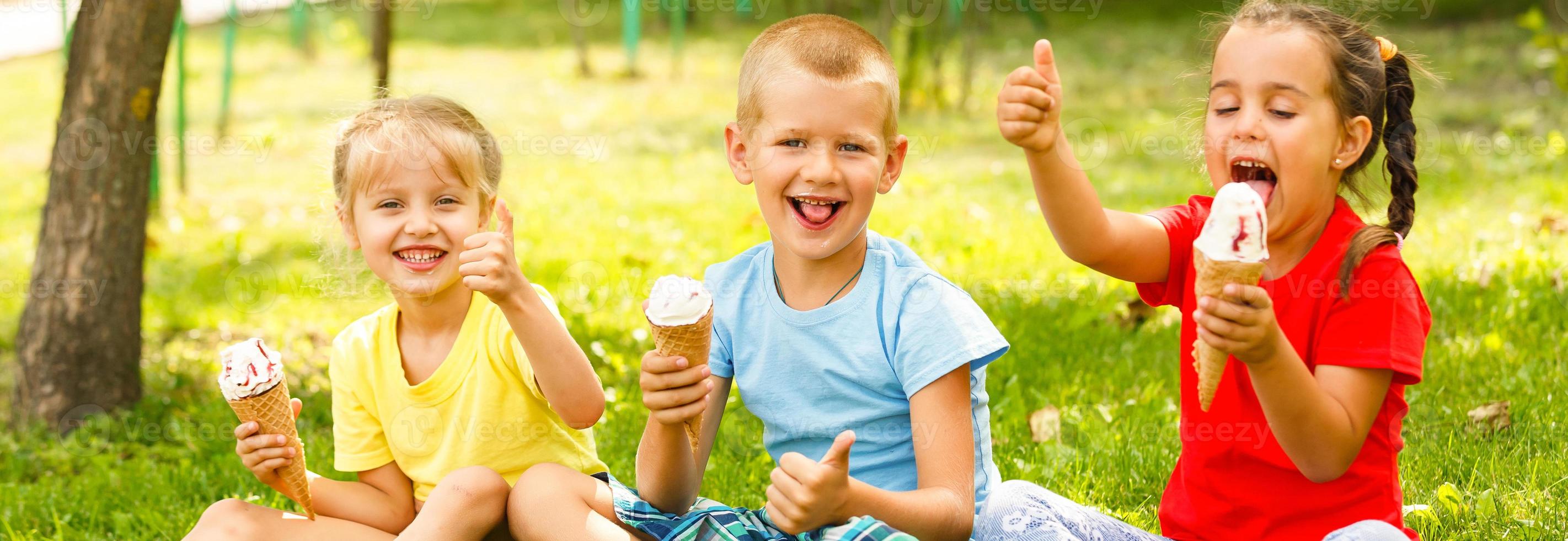 Group of happy little friends having fun at the yard. photo