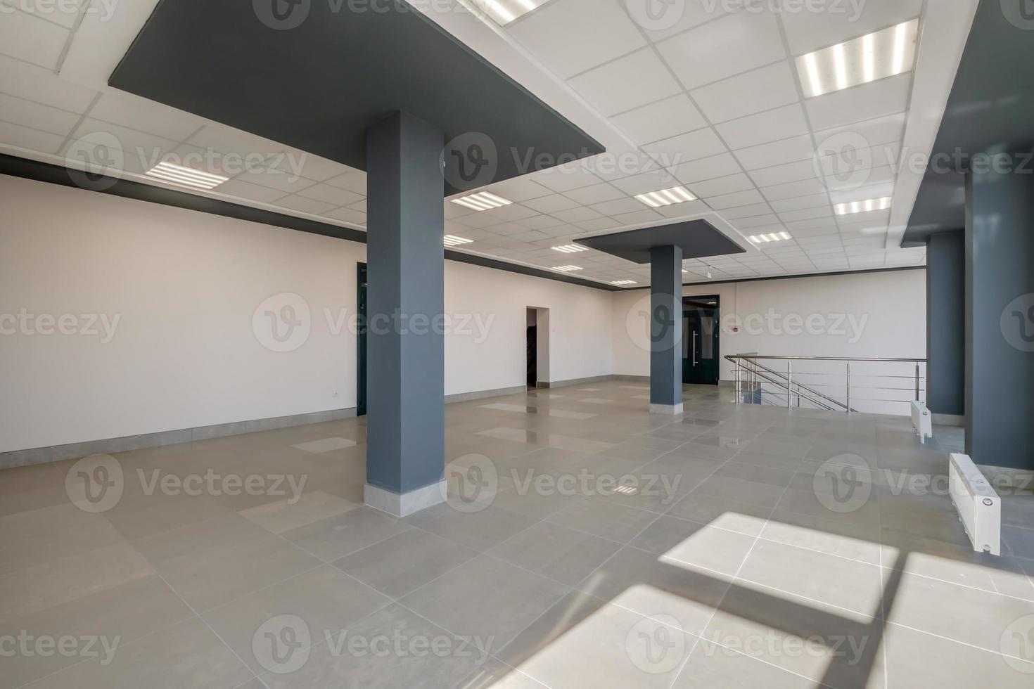 empty modern hall room with columns, doors and panoramic windows photo