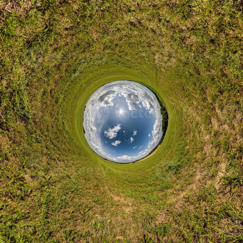 blue hole sphere little planet inside green grass round frame background. photo