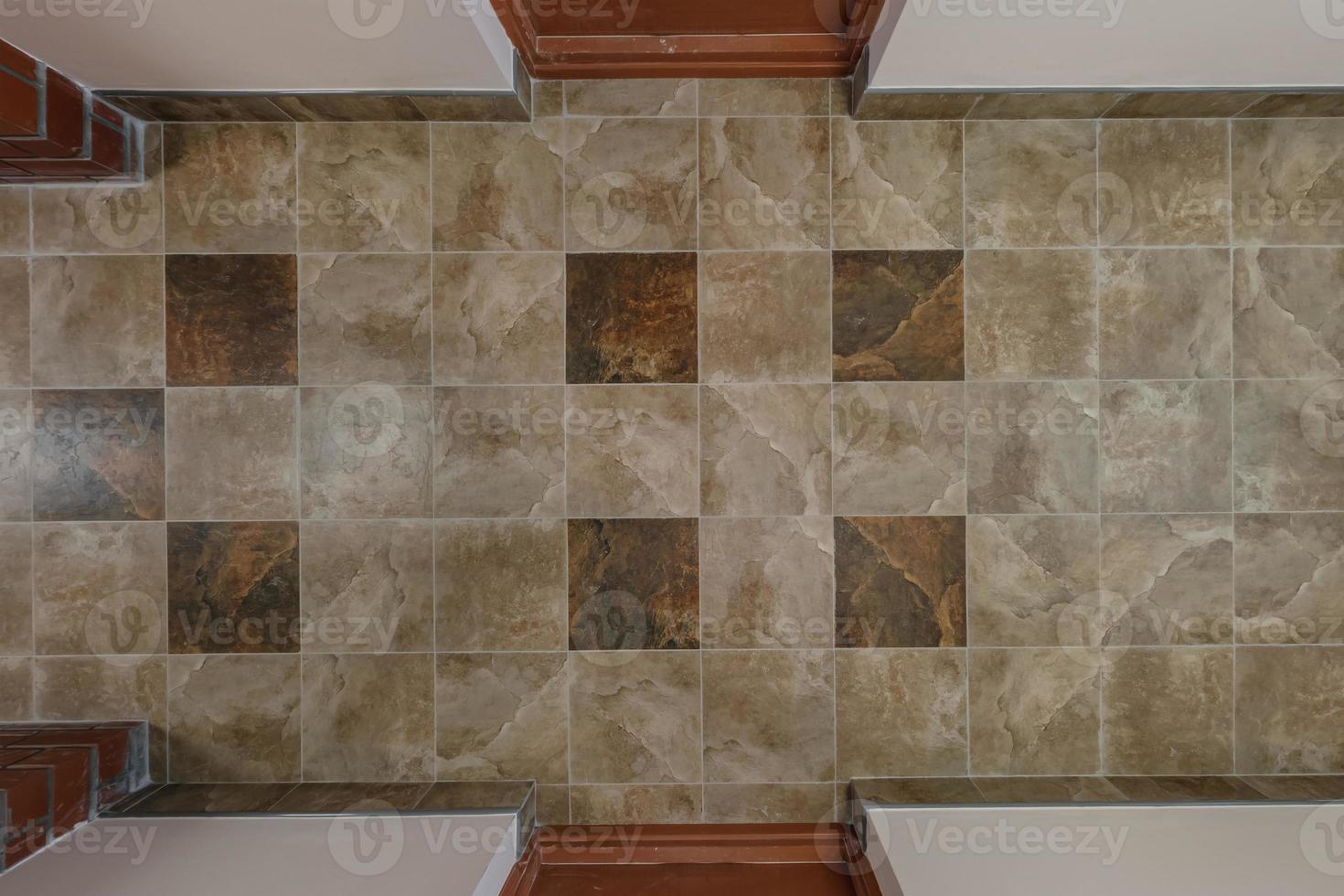 stone and ceramic floor tiles texture in corridor, view from above photo