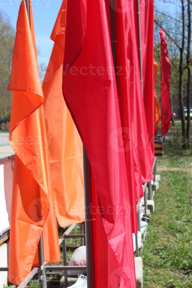 Red flags fluttering in the park for holiday photo