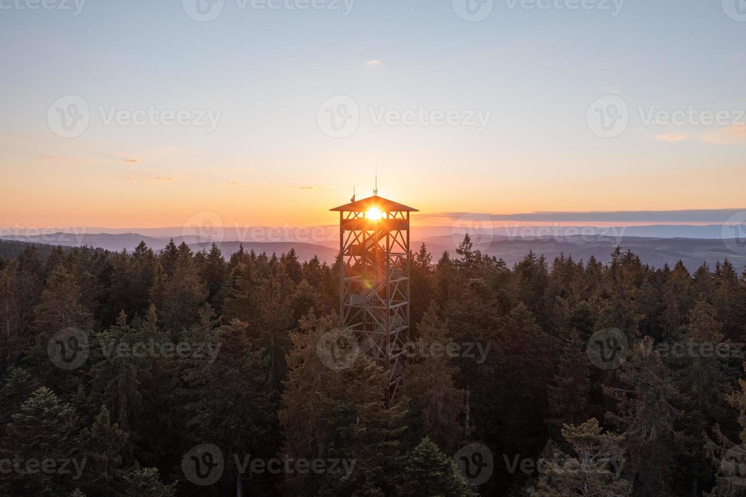 A lookout tower in the middle of the forest photo