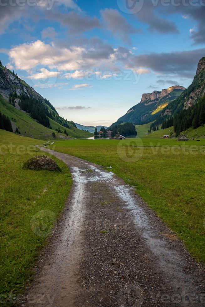 A country road that leads between mountains photo