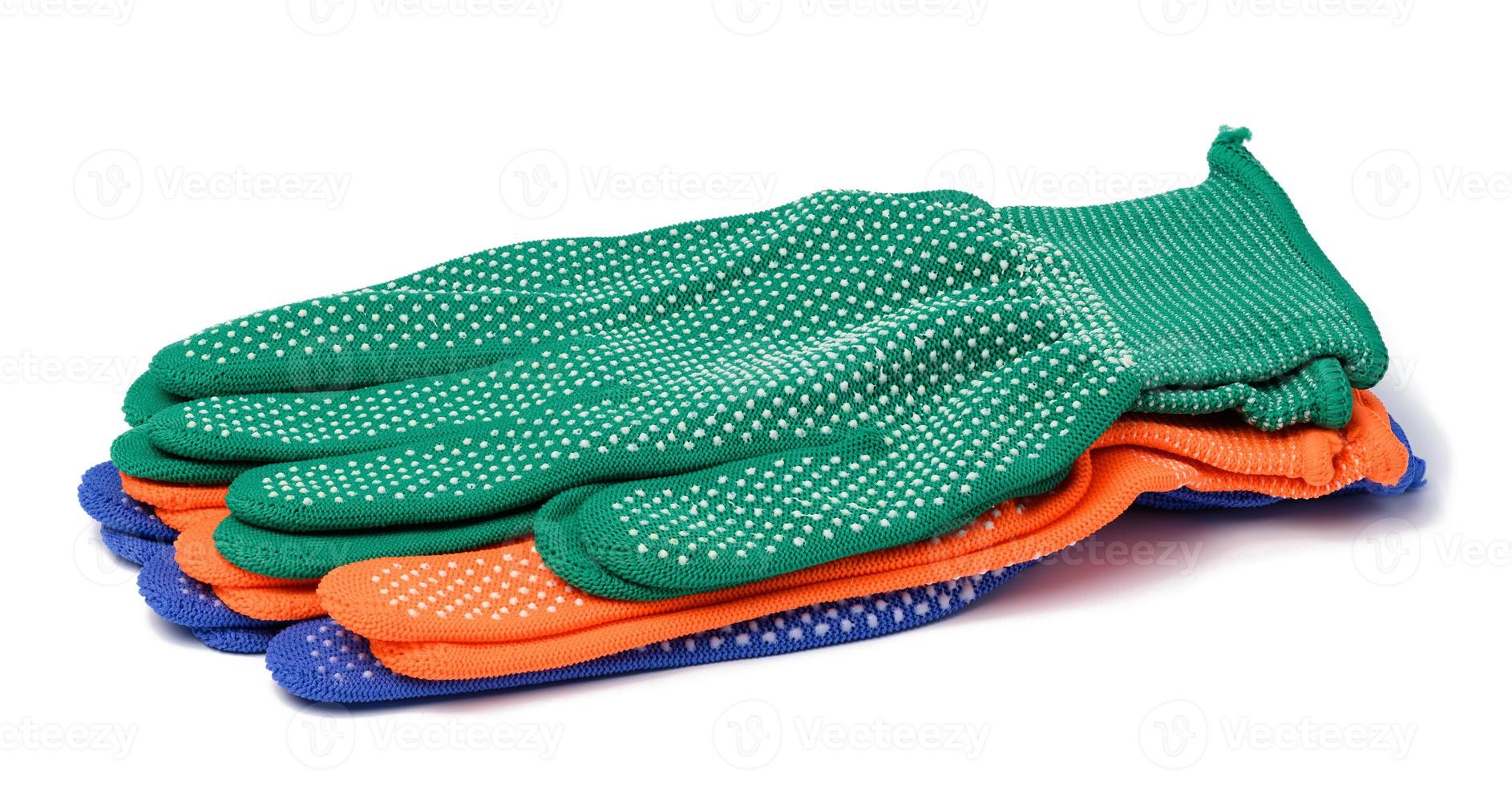 Textile work gloves on a white background. Protective clothing for manual workers photo