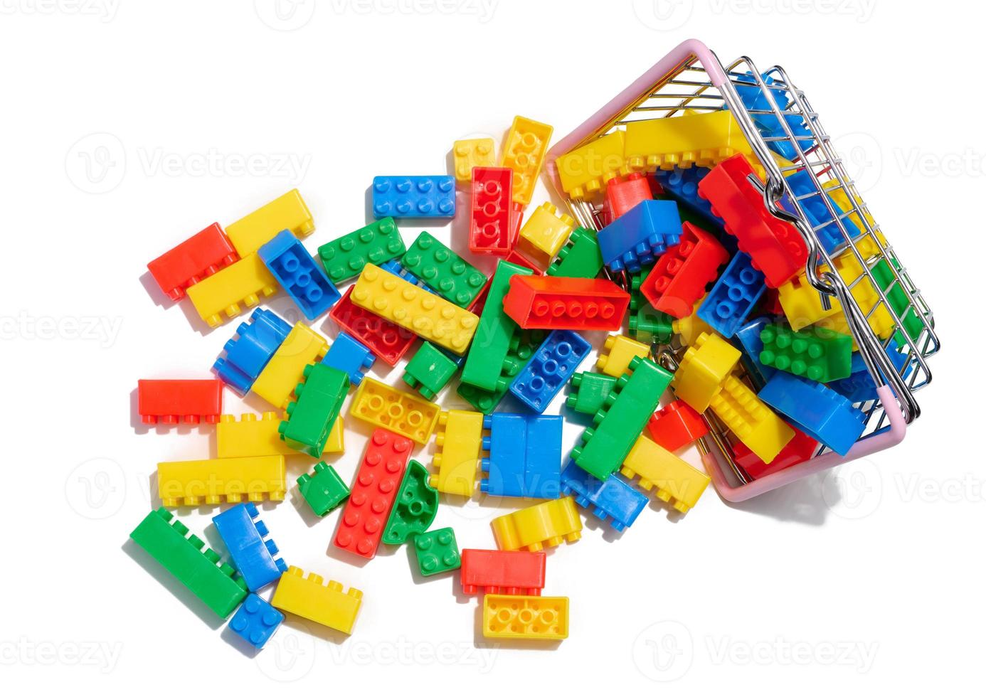 Multi-colored plastic cubes of a children's designer on a white isolated background photo