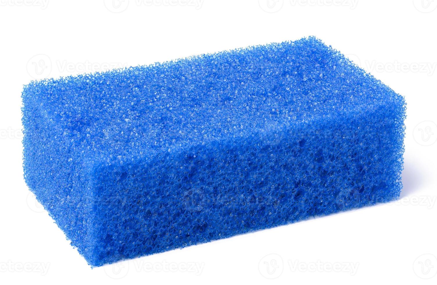 A blue rectangular sponge on a white isolated background. photo