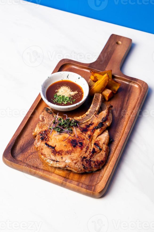 grilled pork chop steak with spicy jaew sauce photo