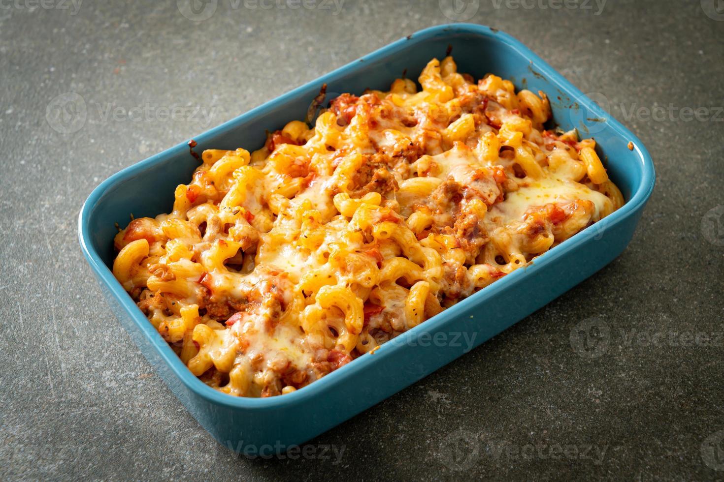 homemade macaroni bolognese with cheese photo