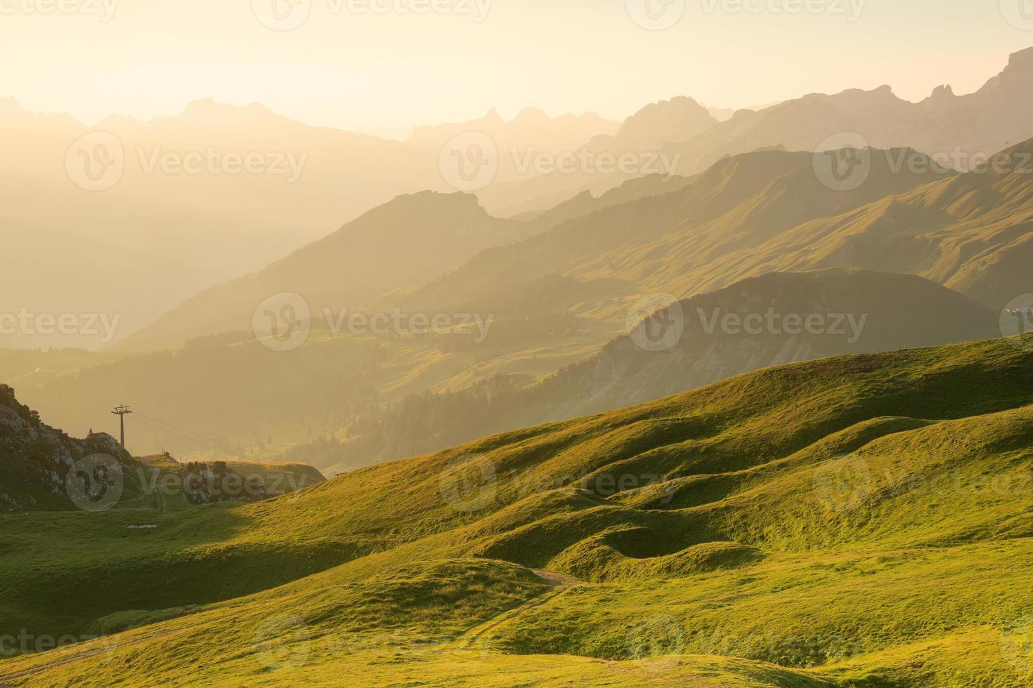 Green mountain landscape with many plains photo