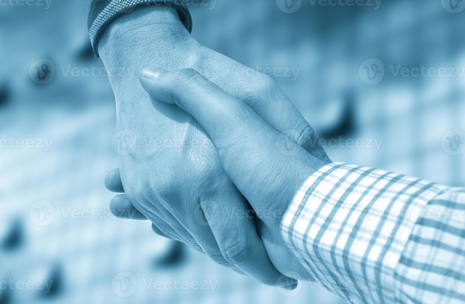 Business handshake close-up photo