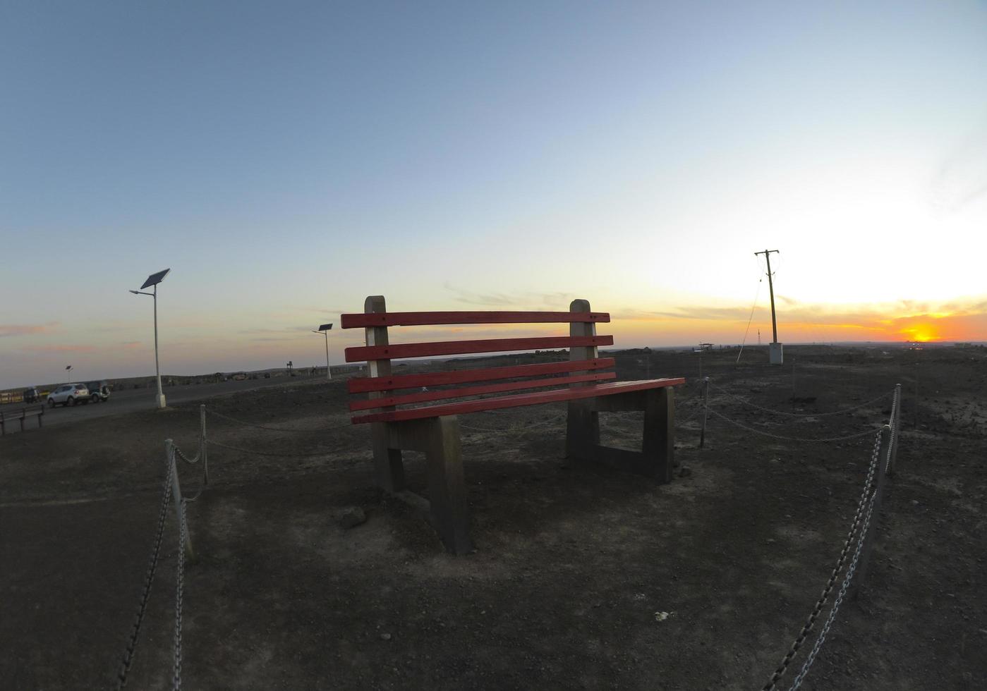 BROKEN HILL, AUSTRALIA. - On December 26, 2019. - The Big Bench of Broken Hill, at 2.5 times the size of a normal park bench this art installation at The Line of Lode with sunset sky. photo