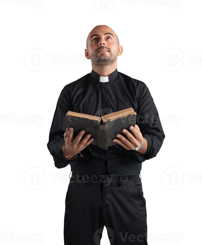 Priest praying on white background photo