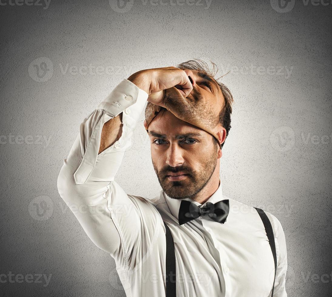 Liar concept with man wearing another face photo