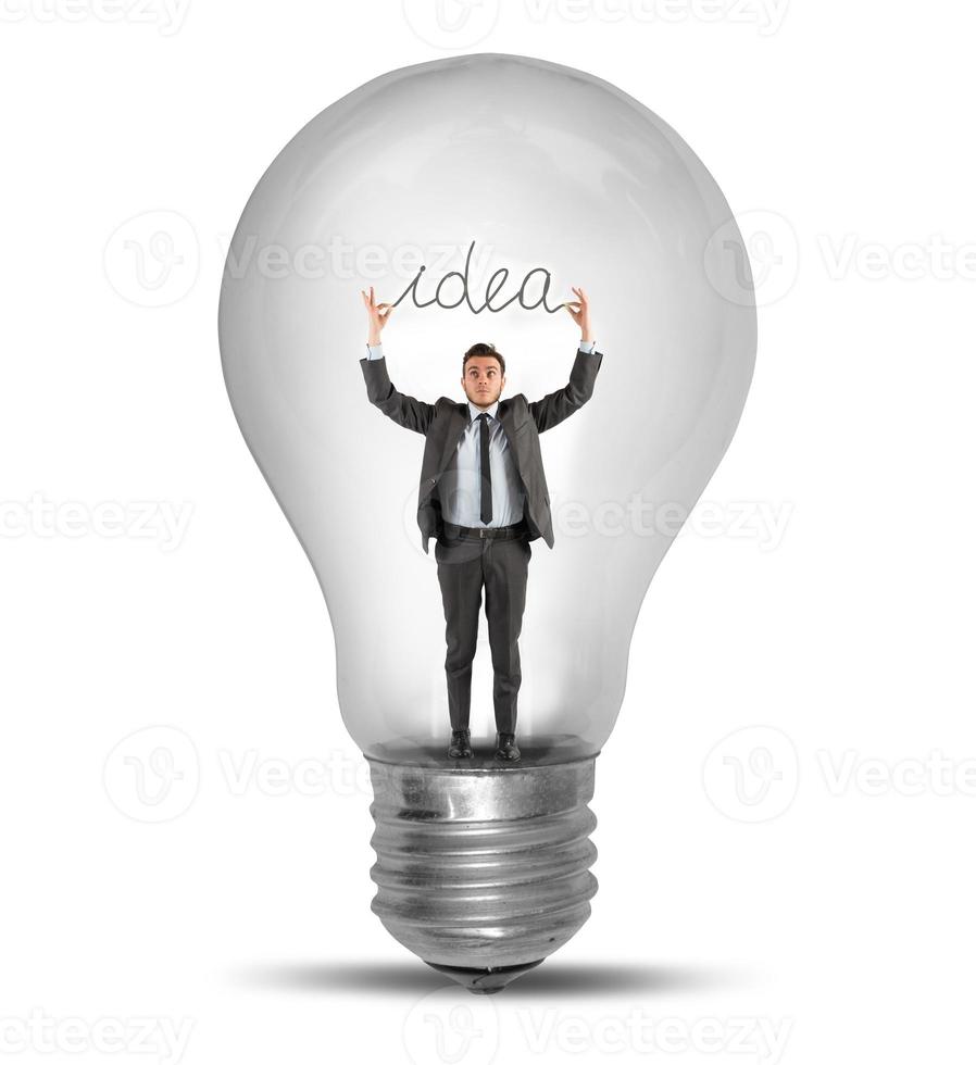 Great idea concept with businessman and light bulb photo