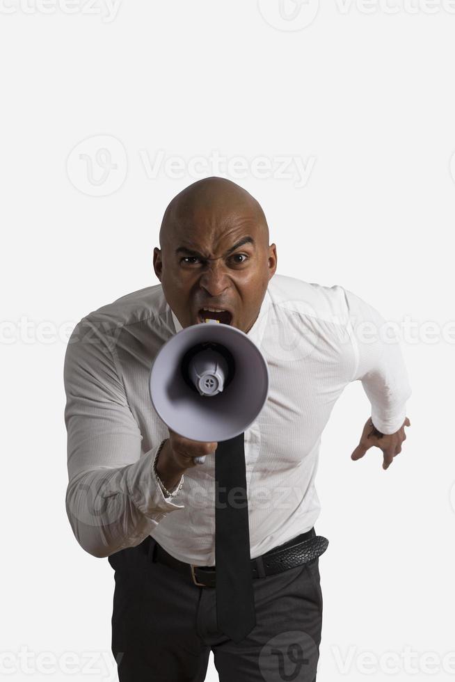 Businessman shouting on the loud speaker photo