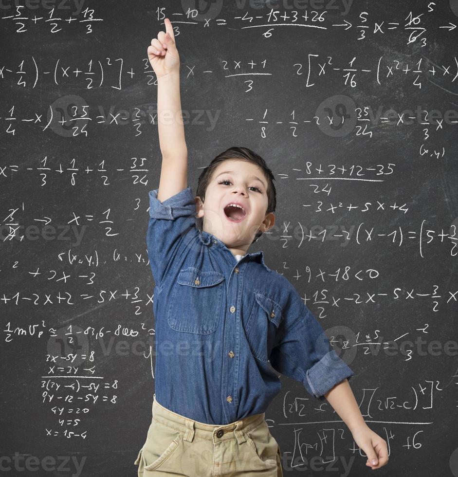 Genius child by a blackboard photo