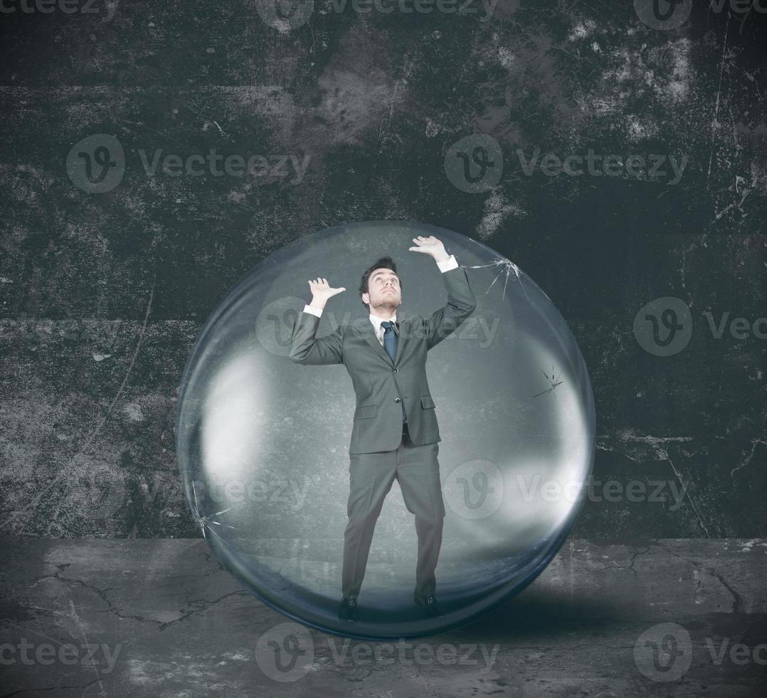 Businessman entrapped on bubble photo