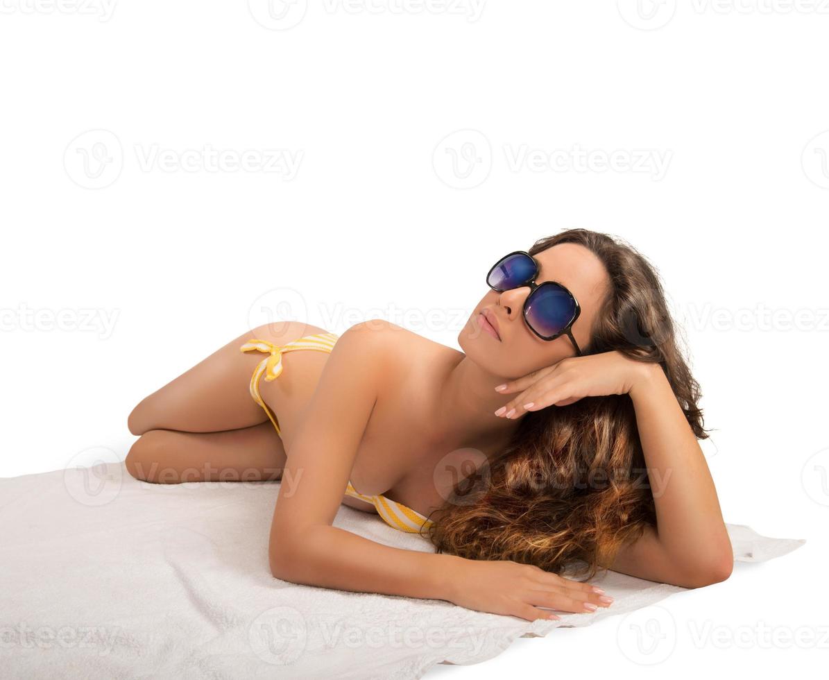 Woman laying with bikini photo