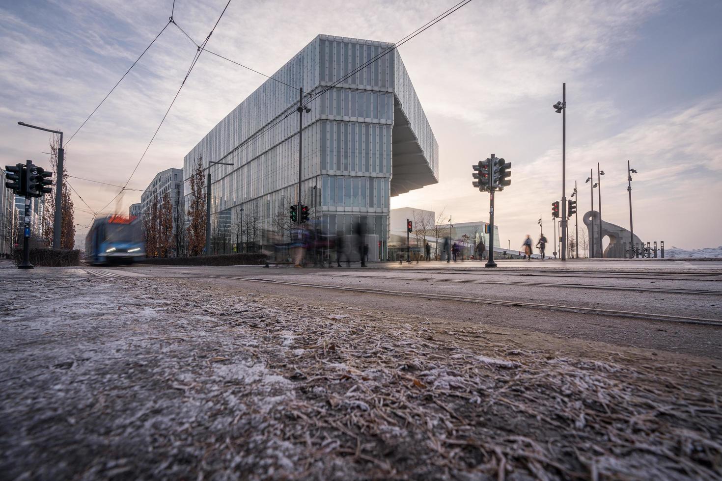 Oslo, Norway 2023, A tram passing the new Deichman Main Library at a cold winter morning photo