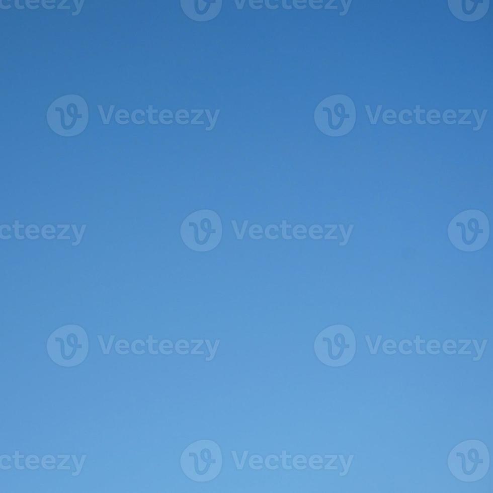 Blue sky background with tiny clouds. Abstract nature background with copy space. photo