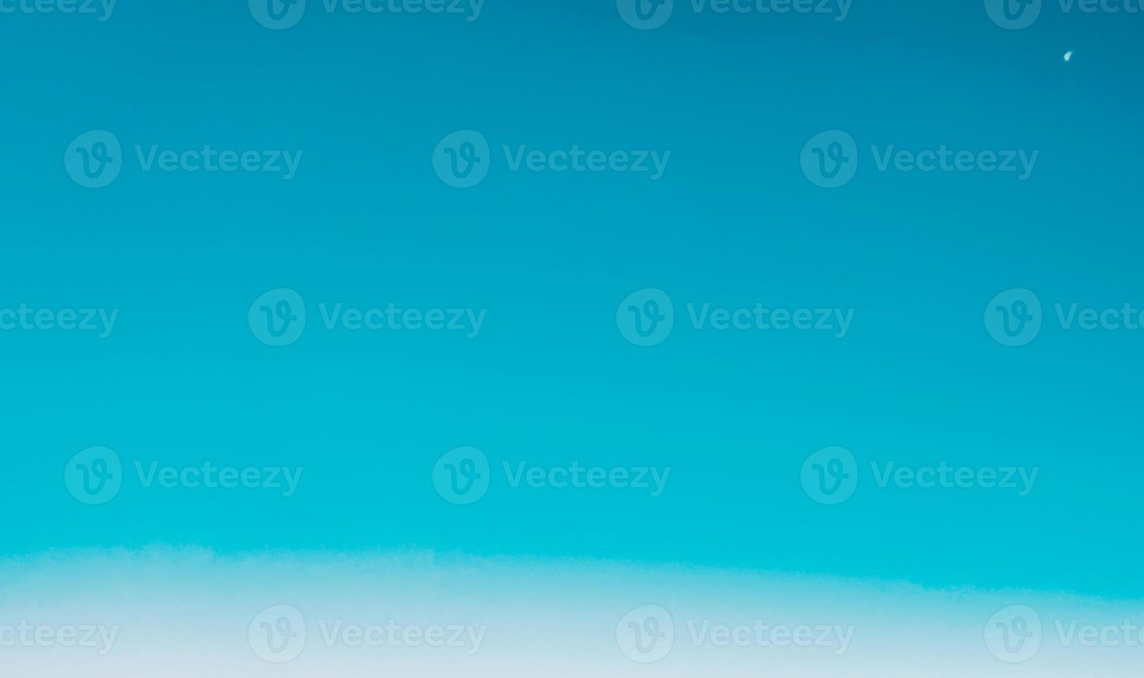 Blue sky background with tiny clouds. Abstract nature background with copy space. photo