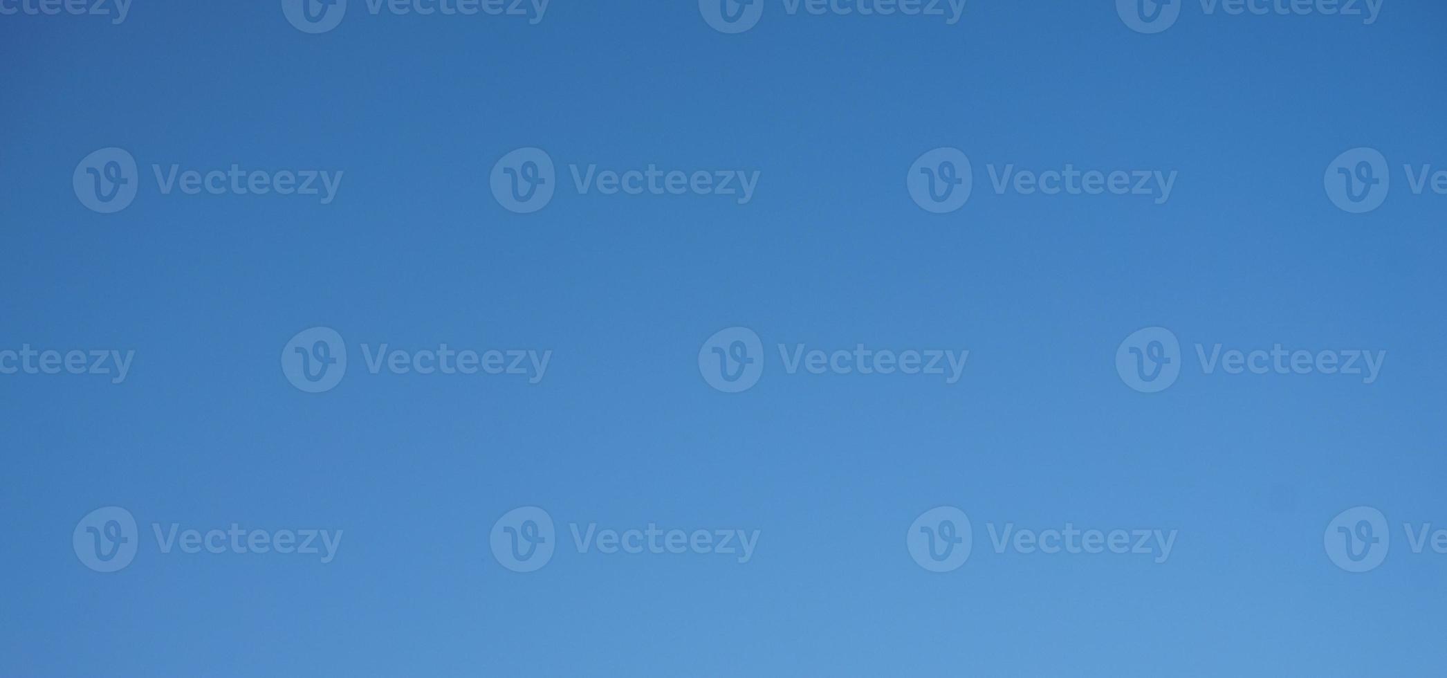 Blue sky background with tiny clouds. Abstract nature background with copy space. photo