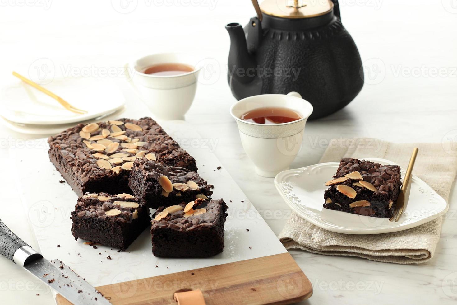 Homemade Fudgy Chocolate Brownies on White Table photo