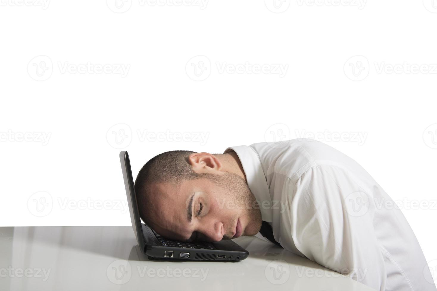 Businessman sleeping on white background photo