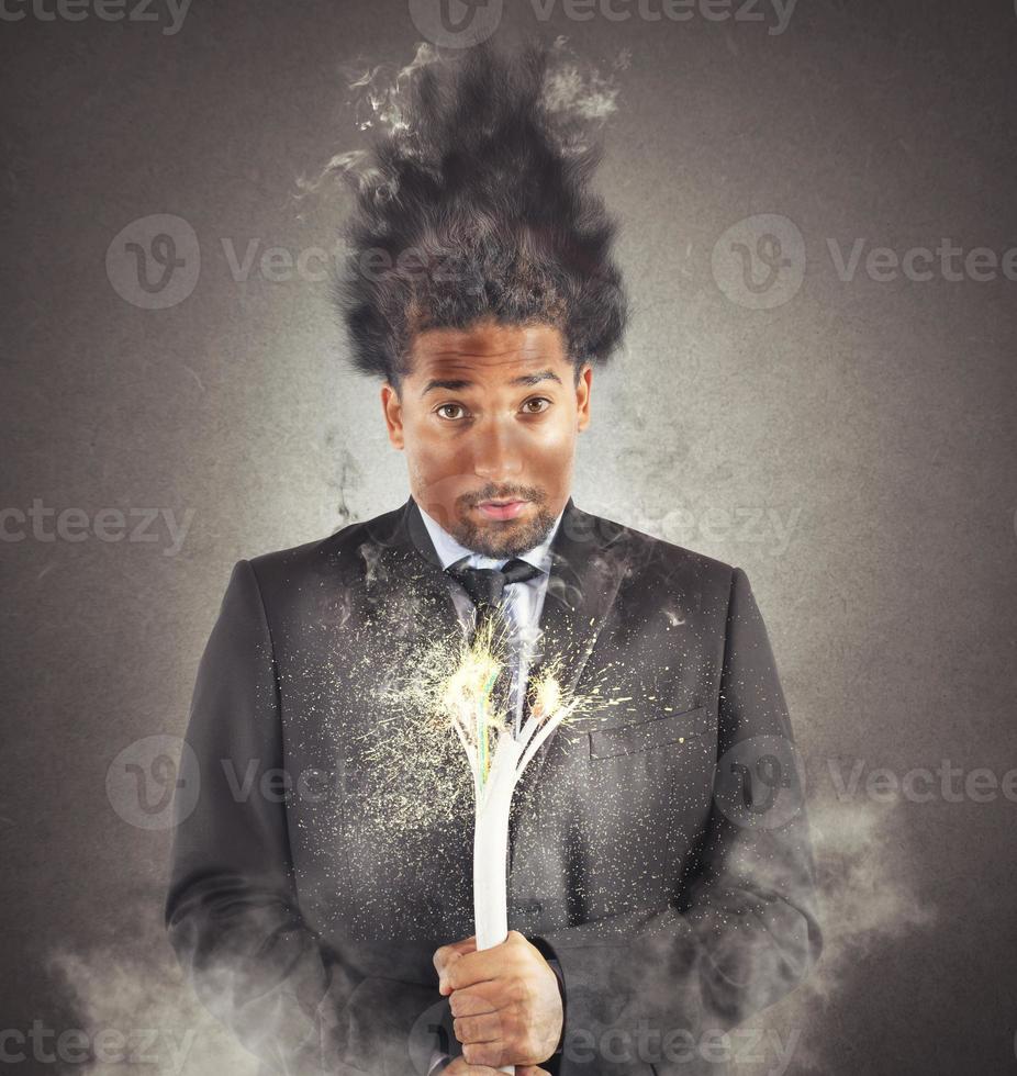 Businessman surprised and electrocuted photo