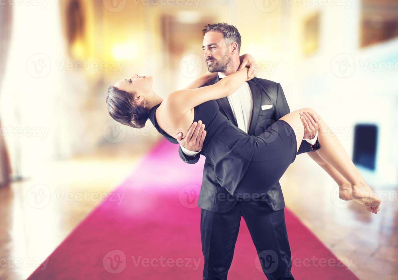 Romantic couple on a red carpet photo