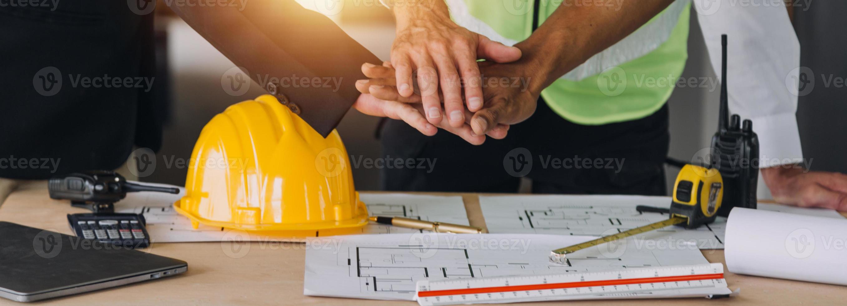 Architect concept, Architects working with blueprints in the office, Vintage Effect photo