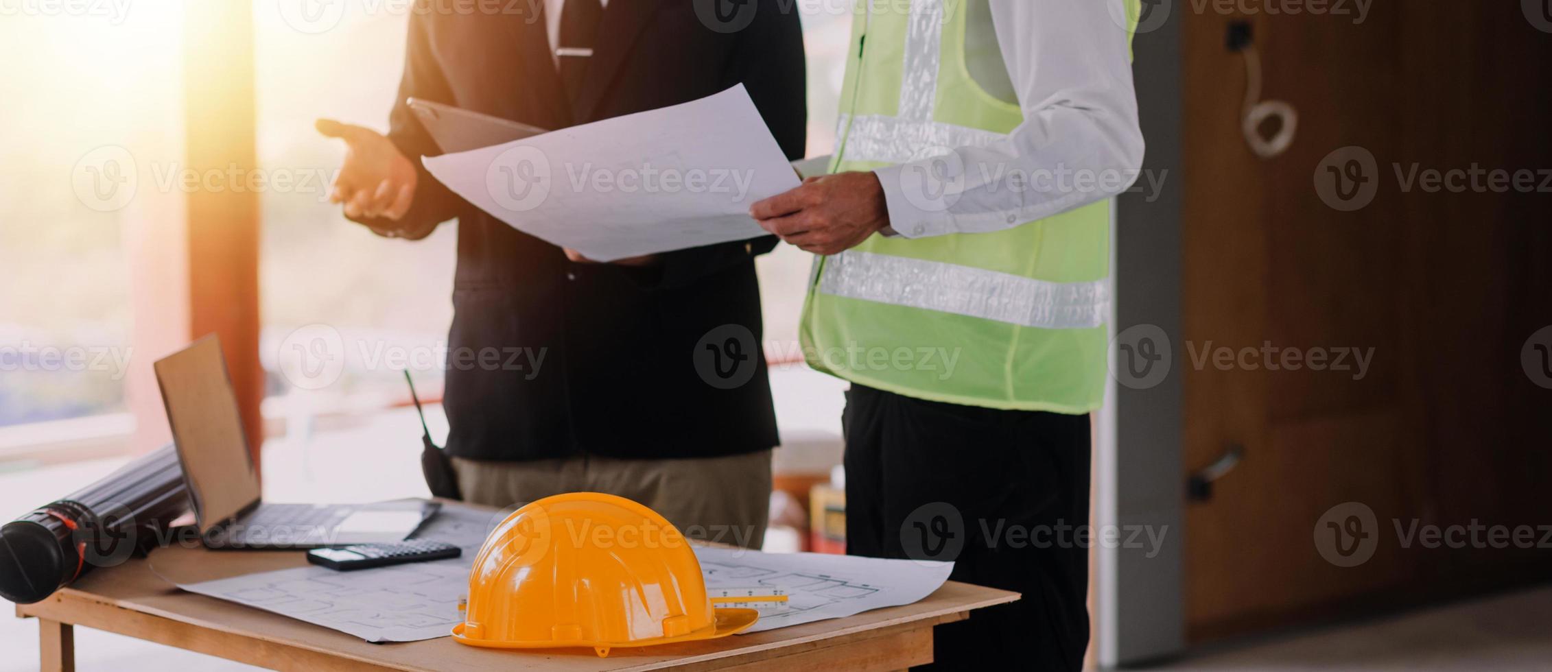 Architect concept, Architects working with blueprints in the office, Vintage Effect photo