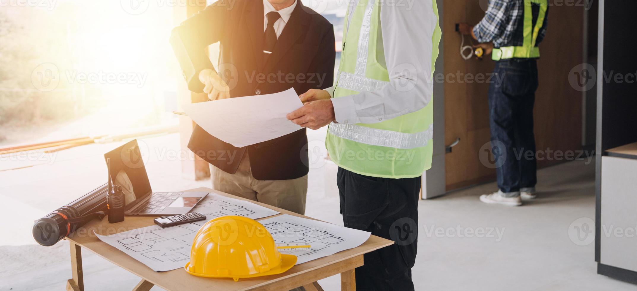 Architect concept, Architects working with blueprints in the office, Vintage Effect photo