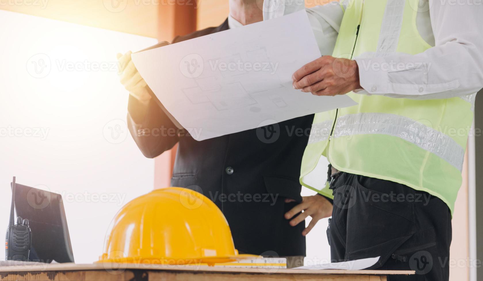 Architect concept, Architects working with blueprints in the office, Vintage Effect photo