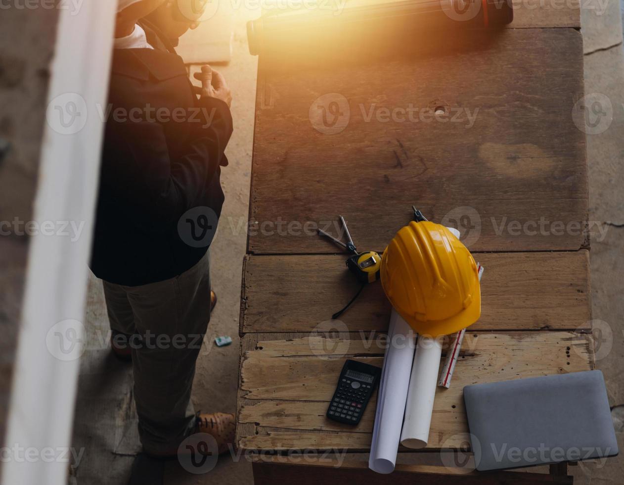 Architect concept, Architects working with blueprints in the office, Vintage Effect photo