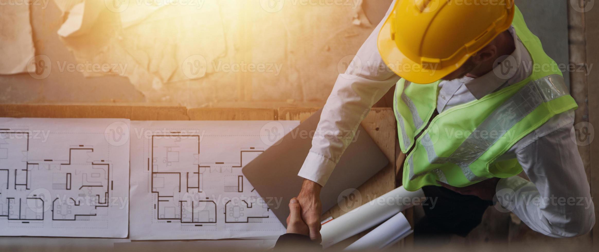 Architect concept, Architects working with blueprints in the office, Vintage Effect photo