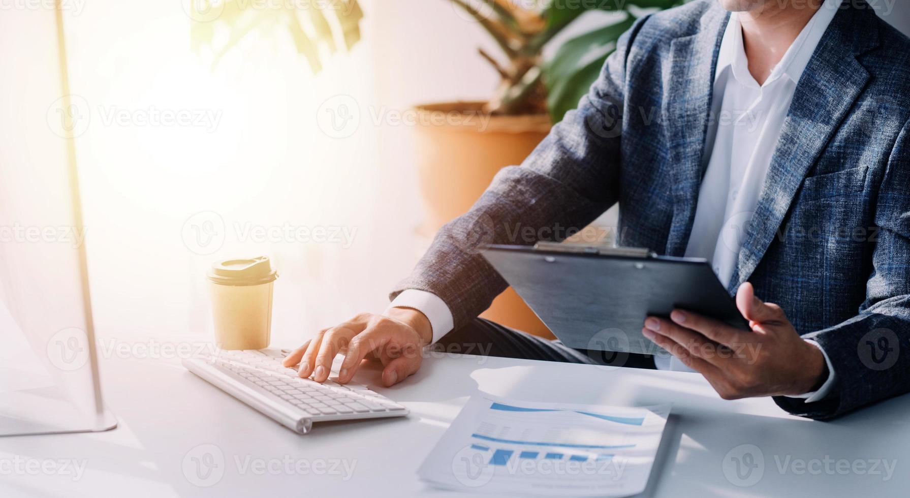 Financial analysts analyze business financial reports on a digital tablet planning investment project during a discussion at a meeting of corporate showing the results of their successful teamwork. photo