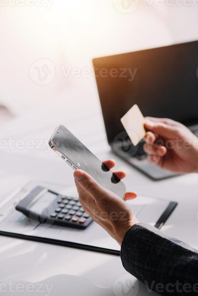 Close up of woman hand using credit card and laptop for payment and online shopping, Online shopping, payments digital banking, E-commerce concept. photo