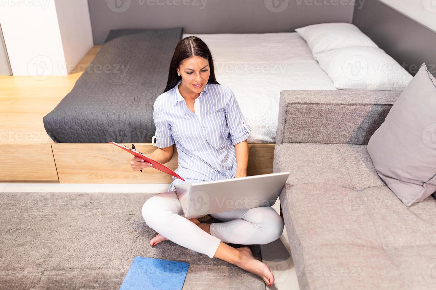 Focused businesswoman presenting charts and graphs on video call online. Young business woman having conference call with client on laptop. Closeup business woman working laptop computer indoor. photo