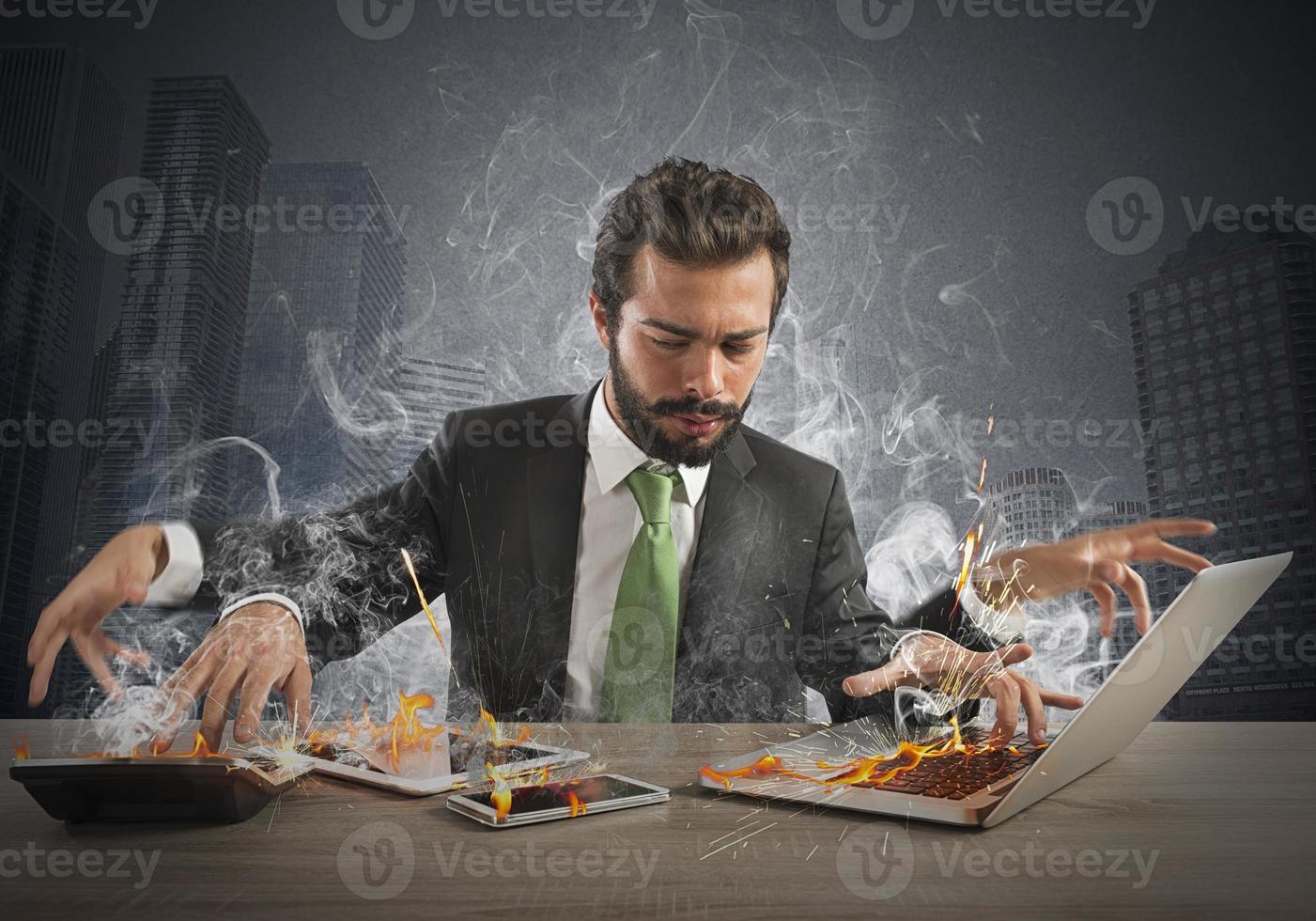 Overworked businessman multi-tasking photo