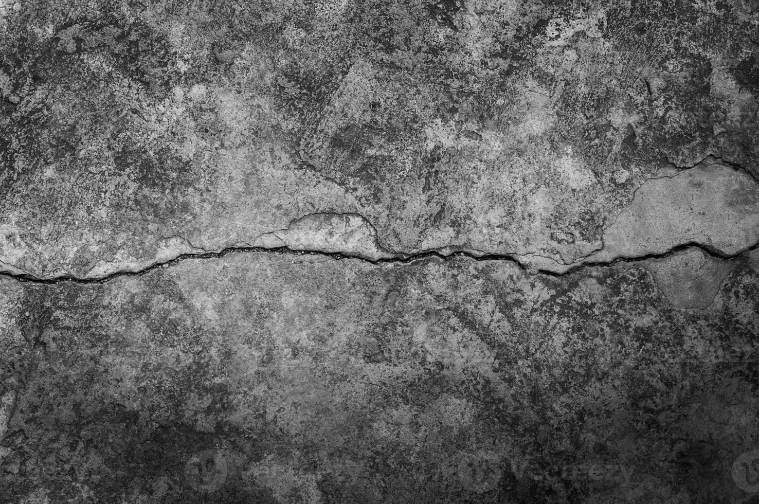 Grungy wall with large crack cement floor texture,cement large crack for dark background photo