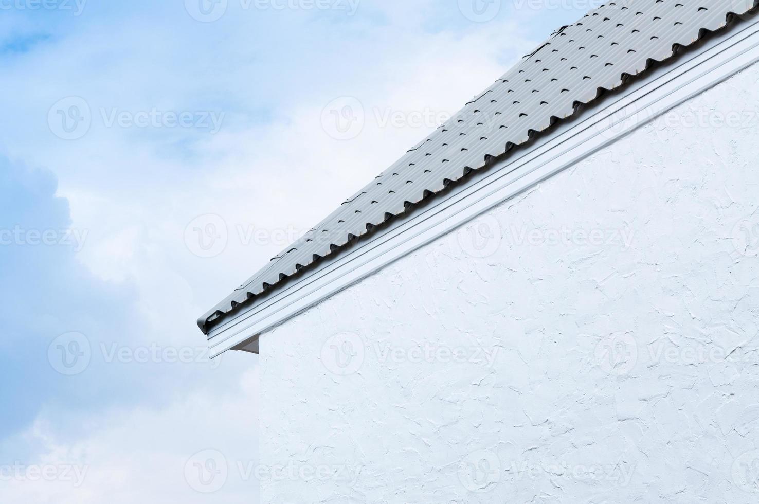 Roof eaves and white wall on blue sky background ,Minimal old geometrical building architecture photo