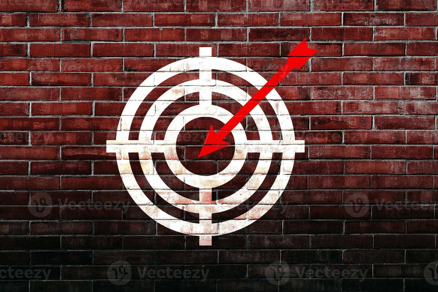 Target figure on brick wall, concept of achieving goal quality, Aim Target Red Symbols of goals and objectives over brick wall background. Business idea photo