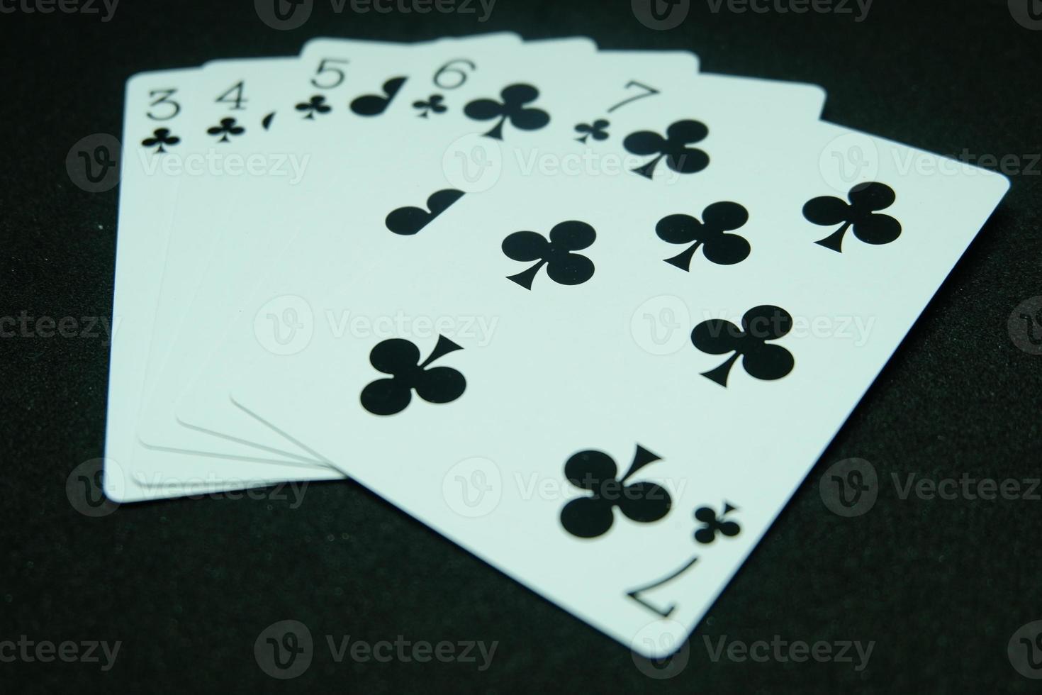 club Straight Flush ,Any sequence all the same suit, for instance 7-6-5-4-3 in black background photo