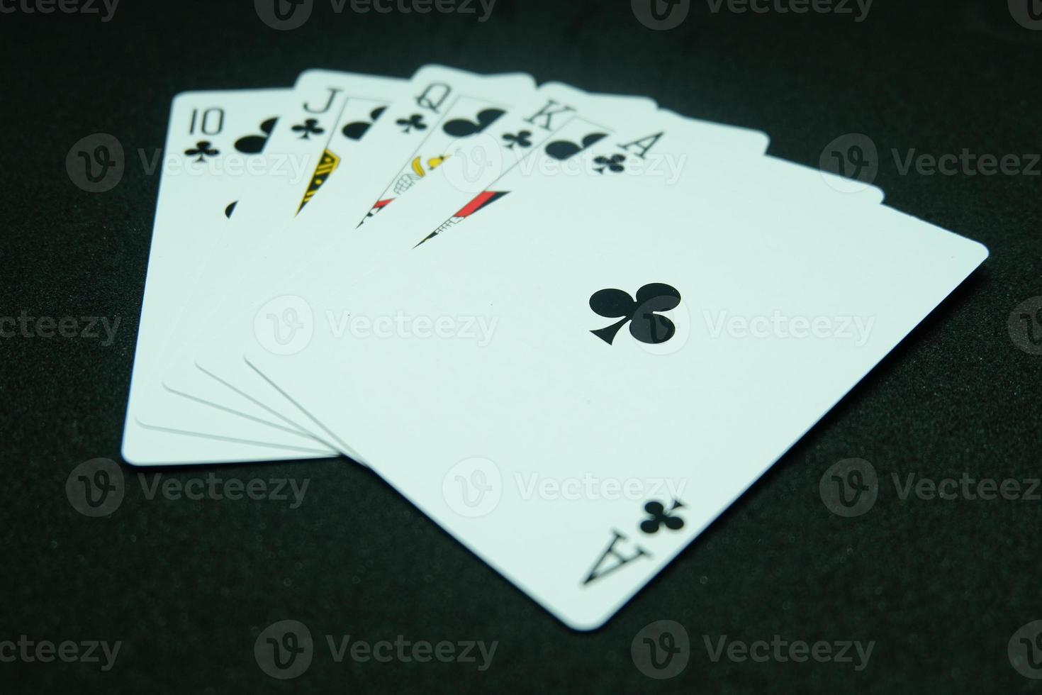 Clubs Royal Flush ,All the same suit, sequence A-K-Q-J-T in black background photo