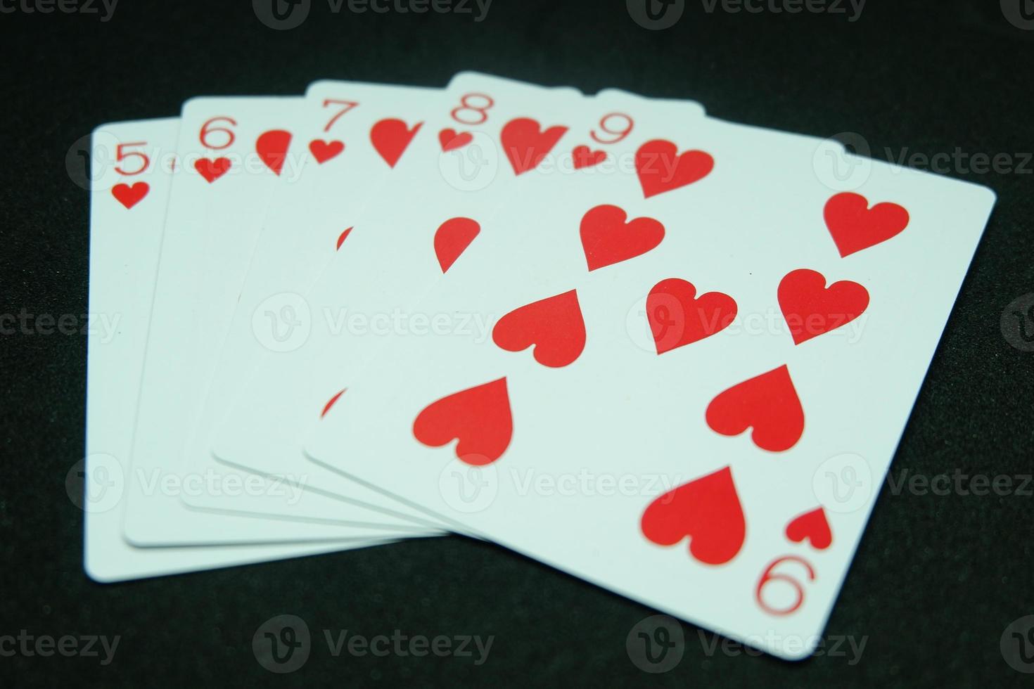 Heart Straight Flush ,Any sequence all the same suit, for instance 9-8-7-6-5 in black background photo