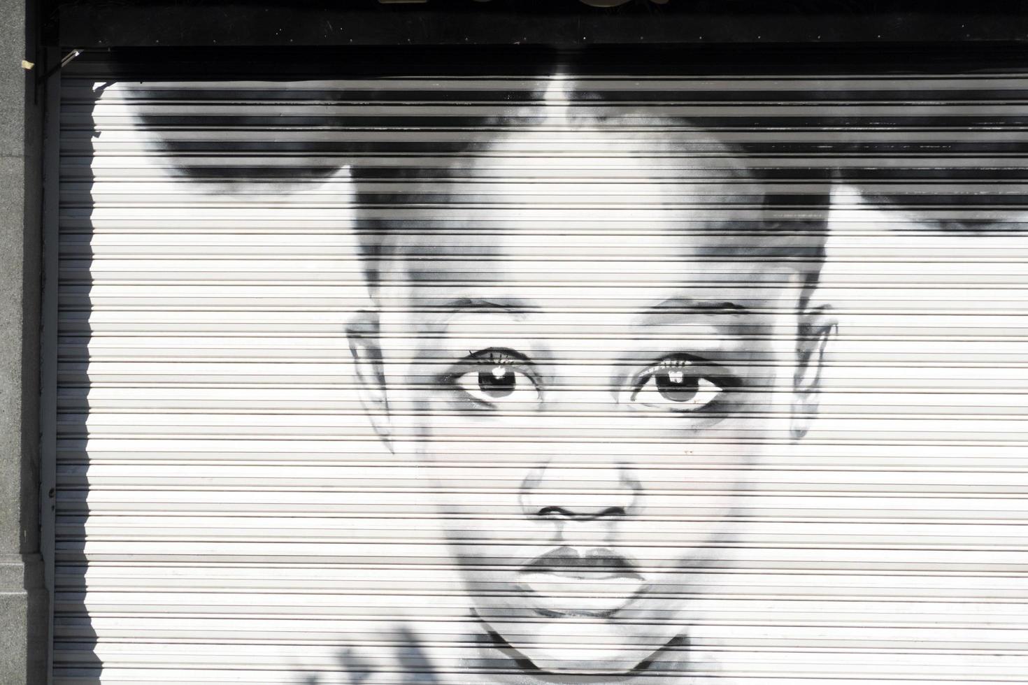 MEXICO CITY, MEXICO - JANUARY 30 2019 - All the shops roll down gates have spray painted graffiti photo