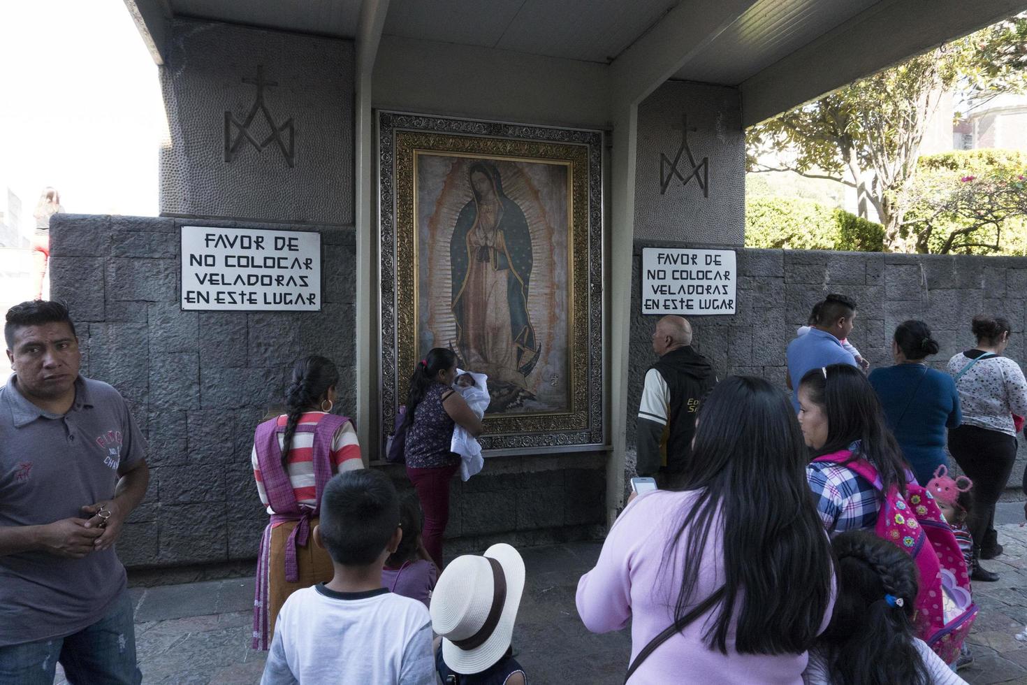 MEXICO CITY, MEXICO - NOVEMBER 4 2017 - Pilgrims at Guadalupe Cathedral photo