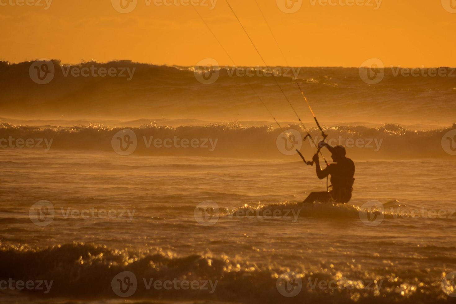 Kitesurfer at sunset photo