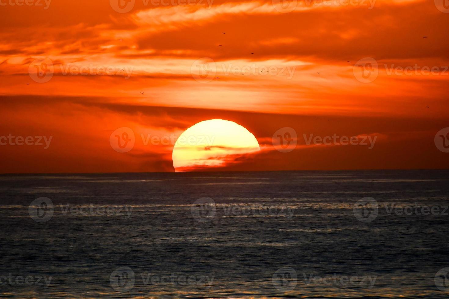 Sunset over the sea photo